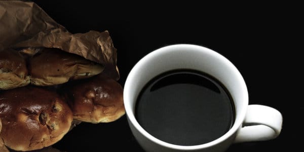 Cup of coffee with raisin buns