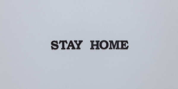 "Stay Home" in black letters on white background