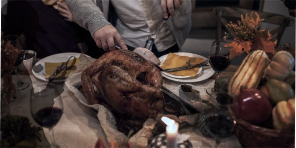 Man carving Christmas turkey.