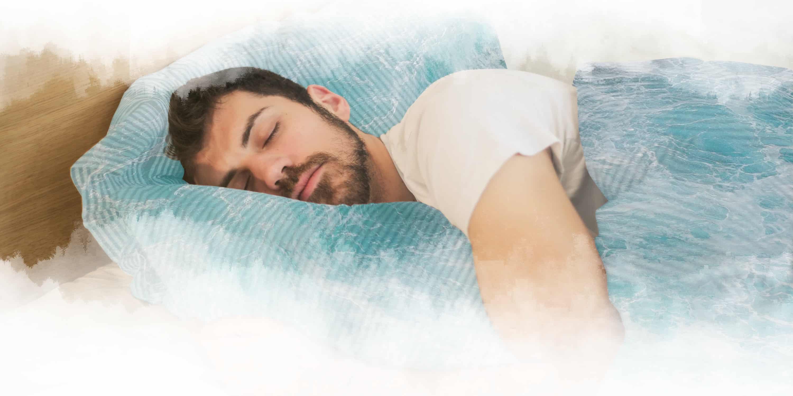 Man sleeping with sheets of water and surrounded by mist.