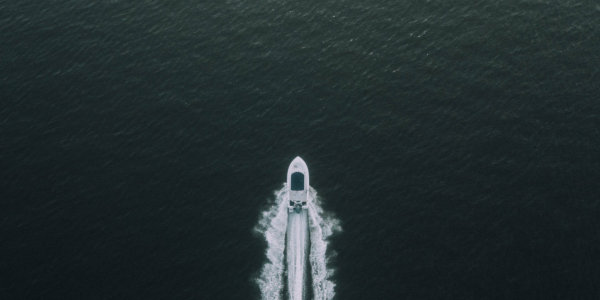 Bird eyes view of boat on water.