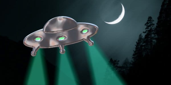 Hovering UFO with moon in background