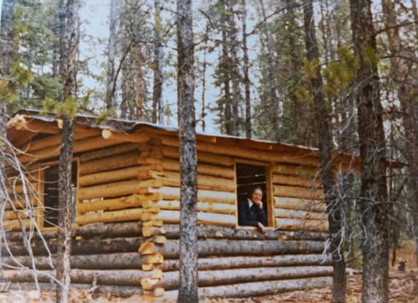 Log cabin in the woods.