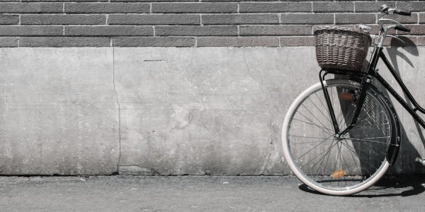 Bicycle leaning against wall