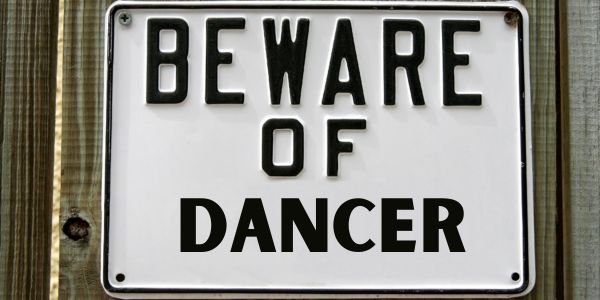 Sign saying "Beware Of Dancer"