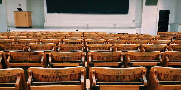 Brown and Black Wooden Chairs Inside University A Lecture Hall