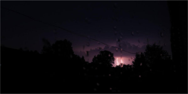 Lightning and rain in the night sky